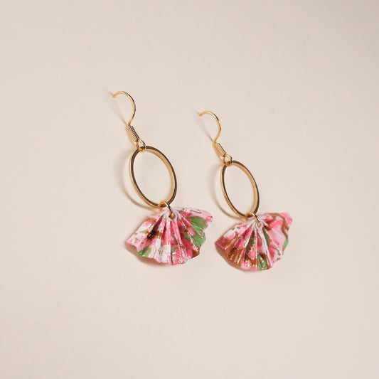 A pair of origami fan earrings with gold-colored hoops and cherry blossom paper fans, displayed against a neutral background.