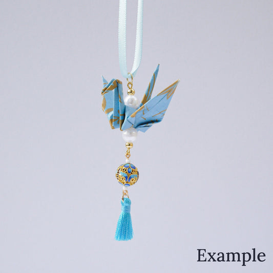 A decorative origami crane charm