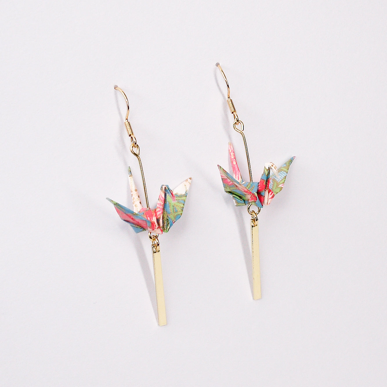 Pair of handmade blue origami crane earrings with flower stalk print, gold bar and hooks, crafted from traditional Japanese washi paper. main view